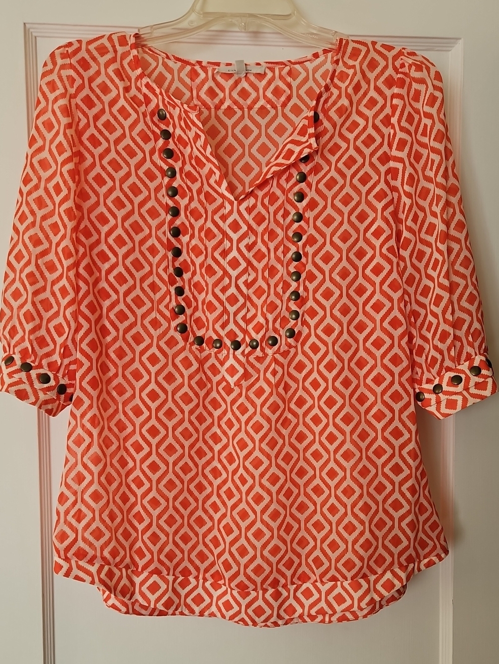 41 Hawthorn Orange And White Blouse Wirh grommet detail. Size M.